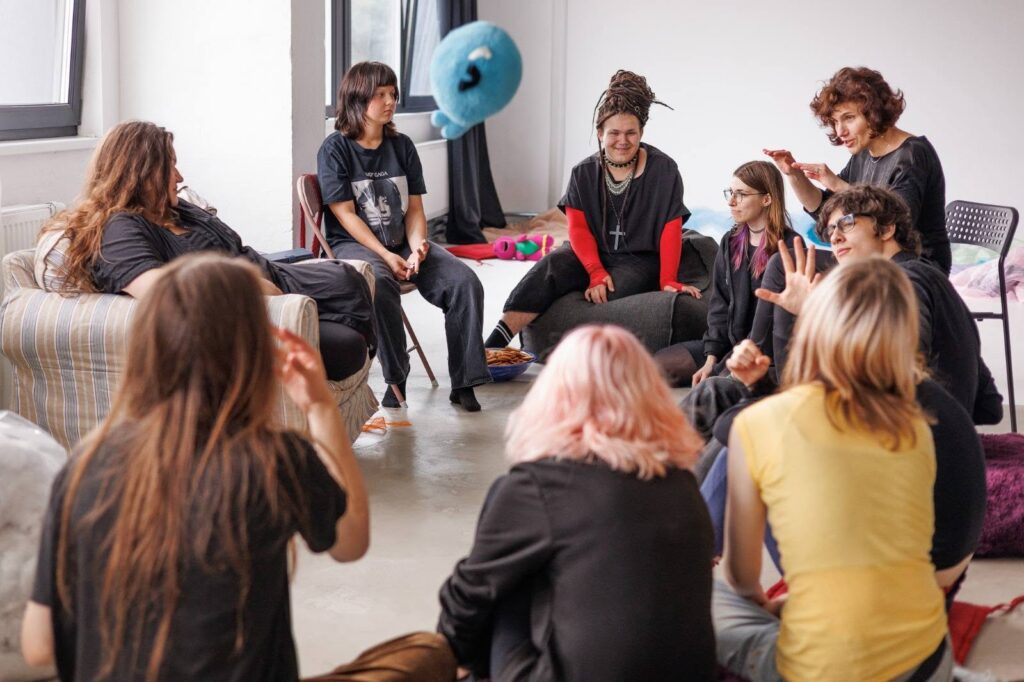 Buffoonery workshop participants sitting in a circle