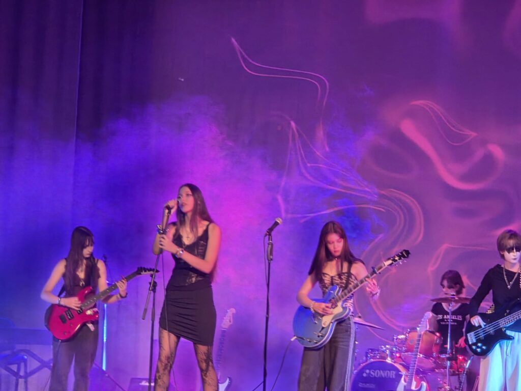 A teenager on stage during the final concert at the Rock Wave summer music camp in Latvia